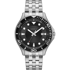 Caravelle by Bulova 43B162 men's watch featuring a matte black dial with luminous indexes and hands, encircled by a unidirectional rotating bezel, paired with a stainless steel bracelet—front view.​