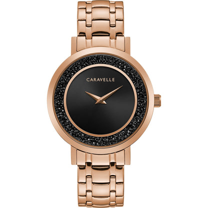 Caravelle by Bulova 44L252 women's watch featuring a black dial with rose gold-tone accents, encircled by jet black rock crystals, and complemented by a rose gold-tone stainless steel bracelet—front view