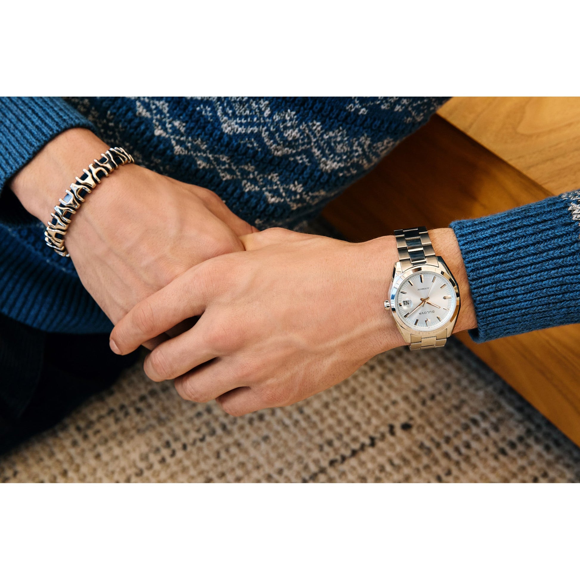 Model wearing Bulova 96B469 automatic watch showcasing elegant wrist presence and light blue dial.