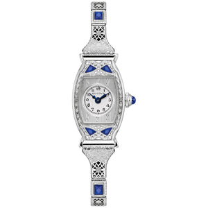 Bulova Miss America 96L340 women's watch with 18.3mm silver-tone stainless steel case, six blue synthetic sapphires, and silver-tone dial with blue hands—front view.