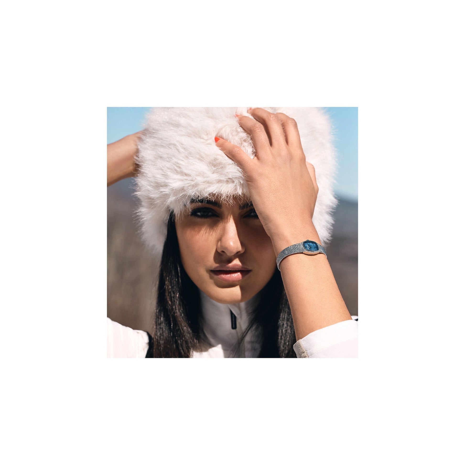 Model wearing the Bulova 96L343 on wrist, showing how the blue sodalite dial and mesh bracelet lend refined elegance in a lifestyle setting.