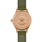 Rear view of the Bulova 98A324 showcasing the screw-down case back and visible bronze patina development.