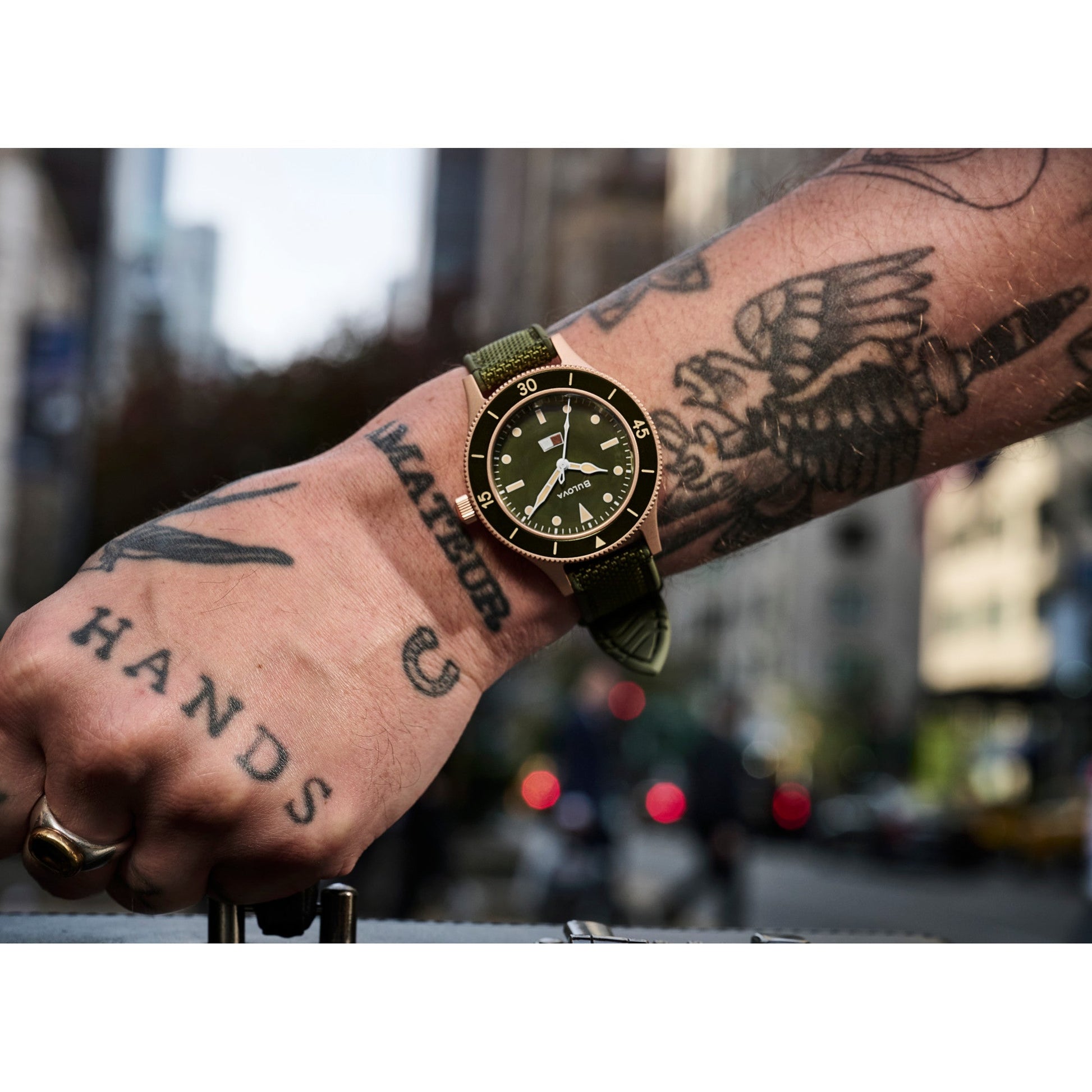 Model wearing the Bulova Mil-Ships 98A324, highlighting its rugged elegance and military-inspired wrist presence.