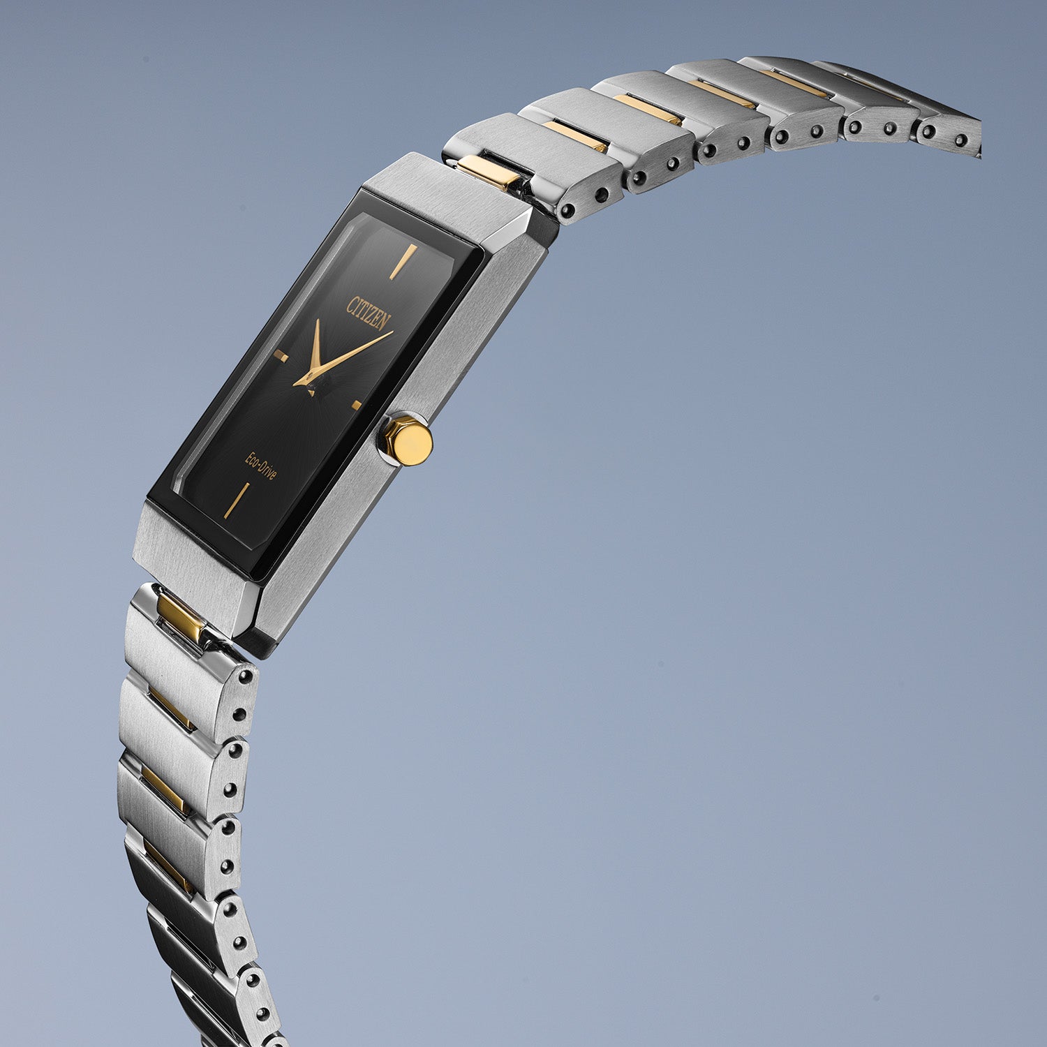 Citizen Stiletto Eco-Drive AR3104-55E featuring a black dial with gold-tone hands and indices, two-tone stainless steel case and bracelet—front view.