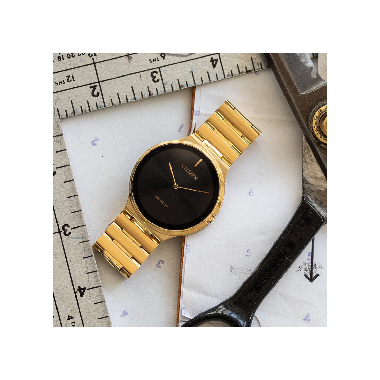 Citizen Stiletto Eco-Drive AR3112-57E featuring a black dial with gold-tone hands, gold-tone stainless steel case and bracelet—front view.