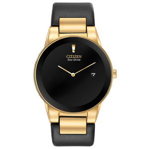 Citizen Axiom Eco-Drive AU1062-05E featuring a black dial with gold-tone hands and date display, gold-tone stainless steel case, and black leather strap—front view.