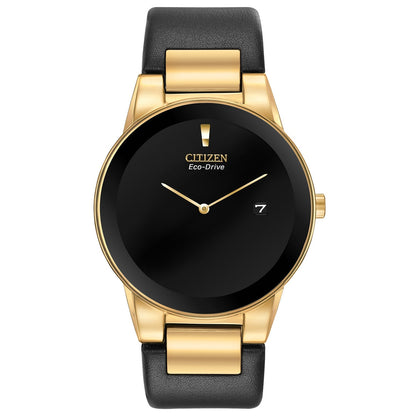 Citizen Axiom Eco-Drive AU1062-05E featuring a black dial with gold-tone hands and date display, gold-tone stainless steel case, and black leather strap—front view.