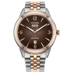 Citizen AW0156-57X front view featuring a 40.5 mm two-tone stainless steel case (silver and rose gold), brown gradient dial with rose-gold Arabic numerals, day window at 12 o’clock and date window at 6 o’clock.
