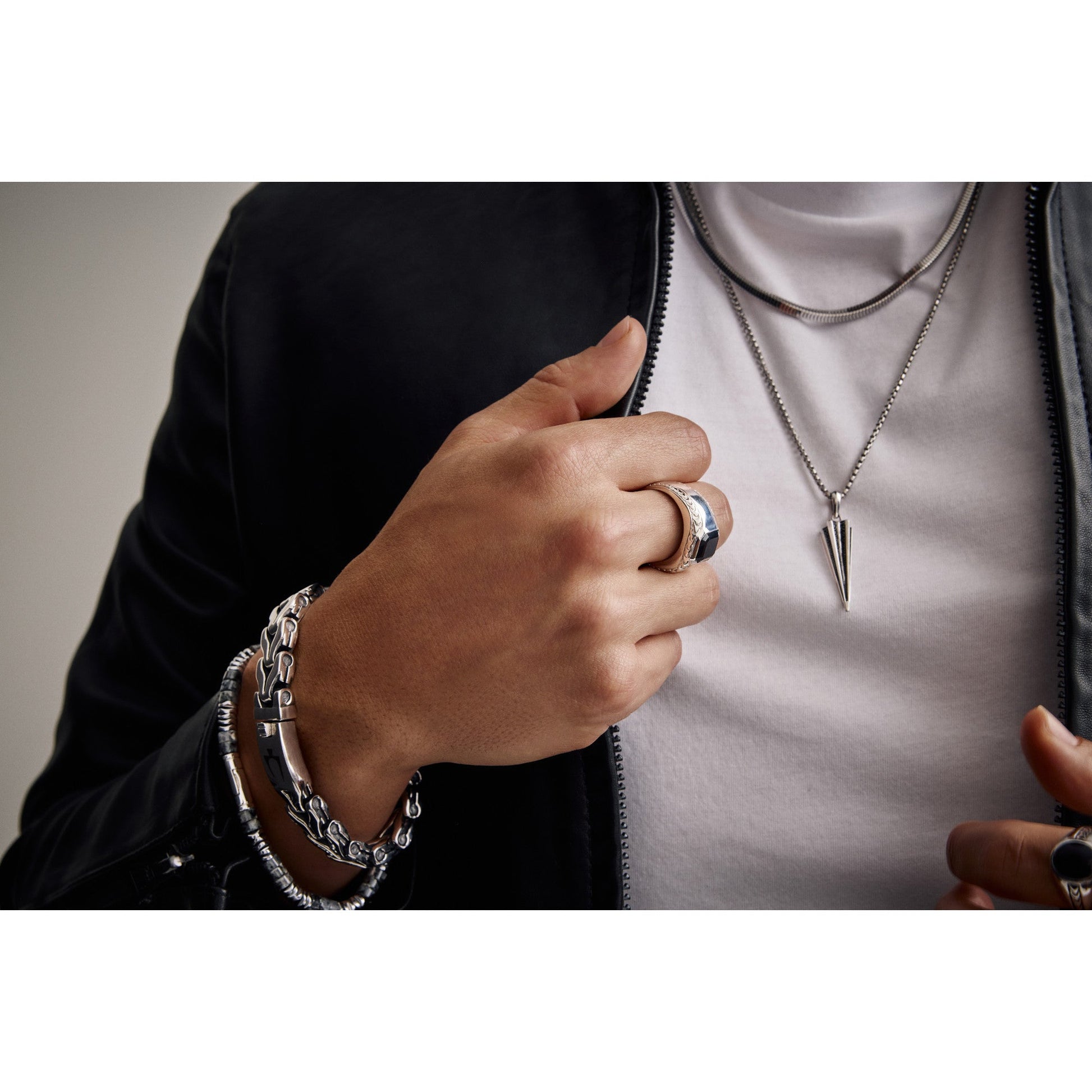 Model wearing Bulova BVC1101-WSNA around the neck, showing how the chain drapes naturally and reflects light elegantly against the skin or fabric.