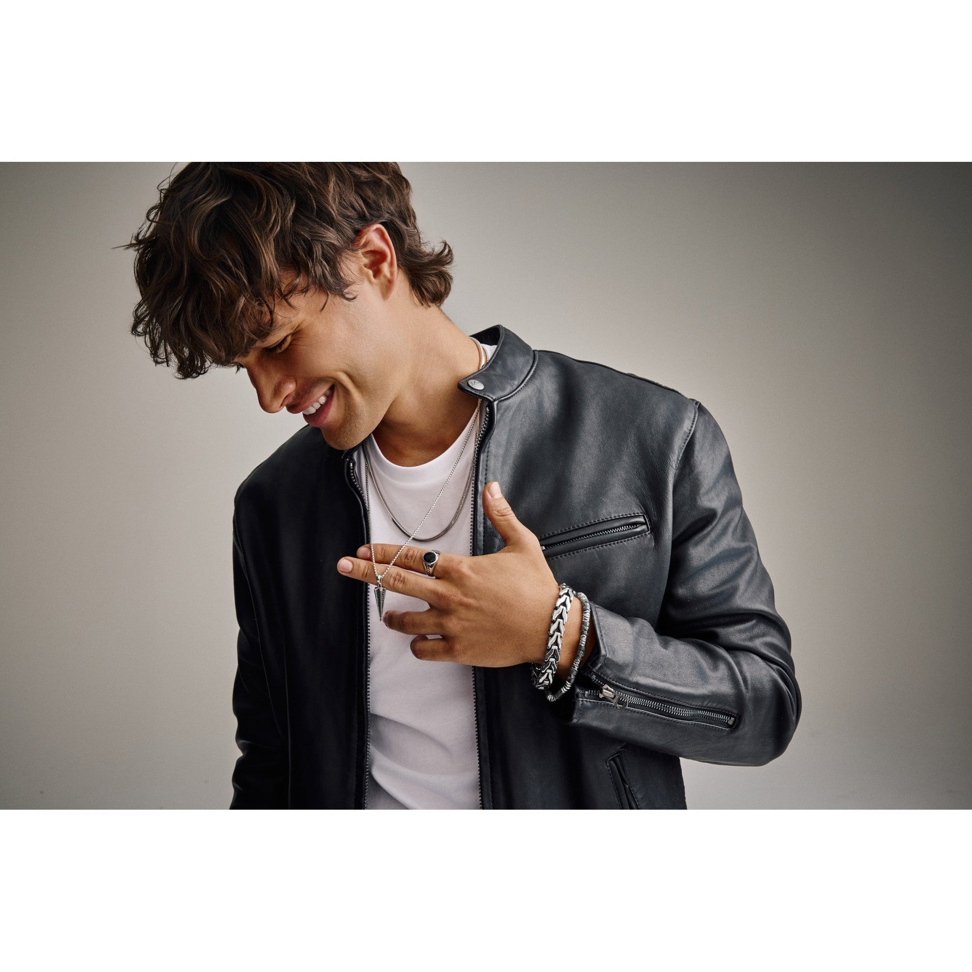 Wrist wearing Bulova BVB1147-NMASTNA, showing the full bracelet wrapping elegantly around the wrist with polished finish and black-edge contrast visible.