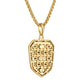 Close-up of the shield pendant on Bulova BVP1123-YSNA — detailing the engraved Guadalupe motif and polished gold finish.