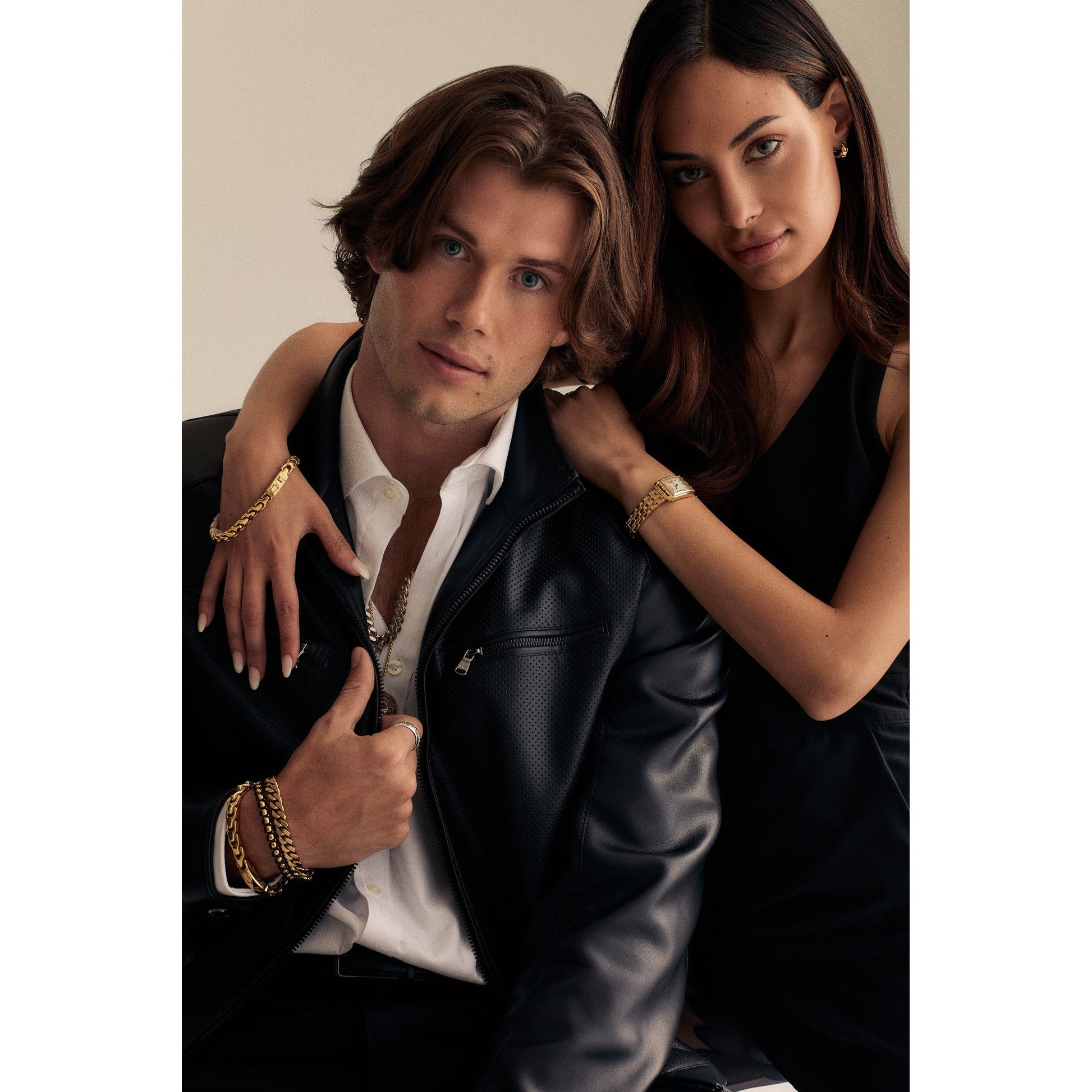 Wrist wearing Bulova BVB1089-G6STBA — gold-tone bracelet with black-cord accents, shown in a lifestyle setting with subtle shadows and polished metal gleam.