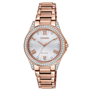 Citizen EM0233-51A Drive watch featuring a pink gold-tone stainless steel case adorned with 64 crystals, silver-tone dial with six crystal accents, and matching bracelet—front view.