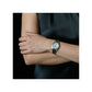 Model wearing the Citizen EM0870-58A, demonstrating its elegant and sophisticated wrist presence.