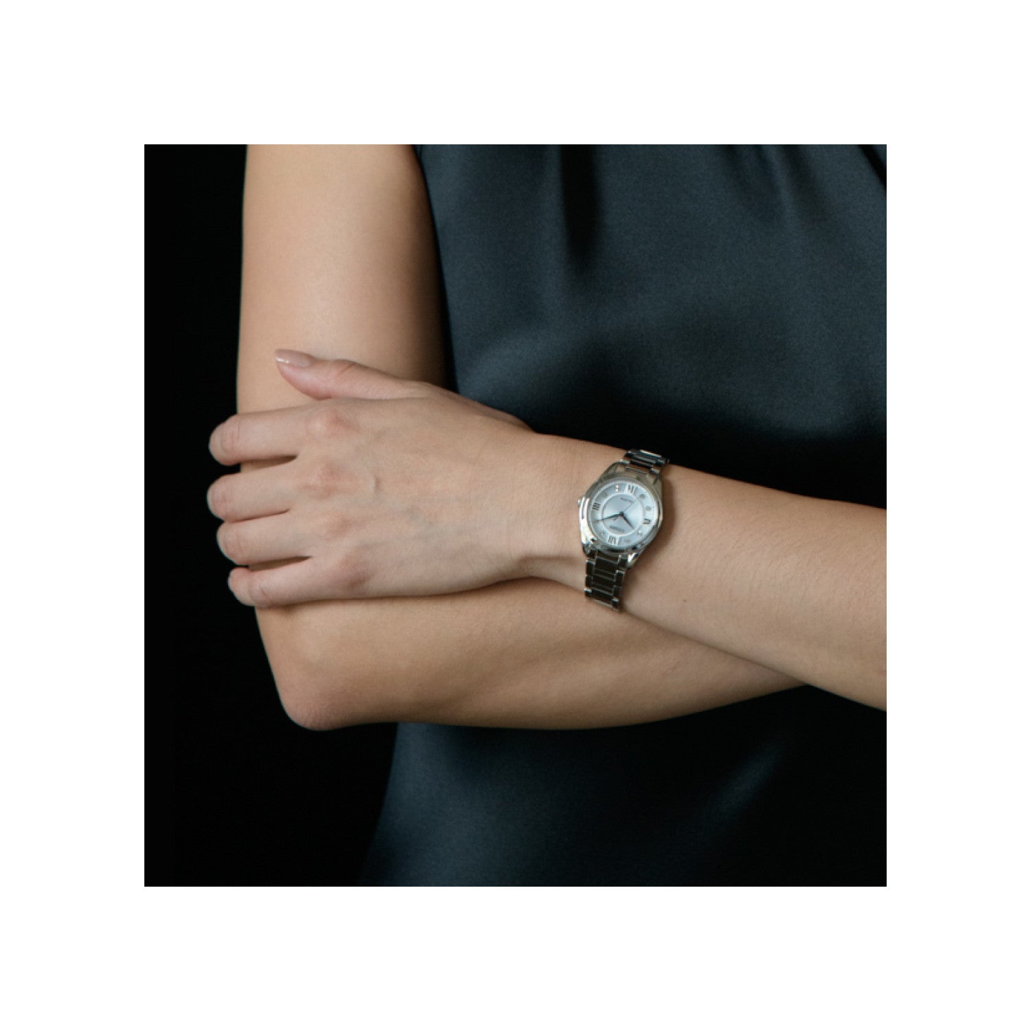 Model wearing the Citizen EM0870-58A, demonstrating its elegant and sophisticated wrist presence.