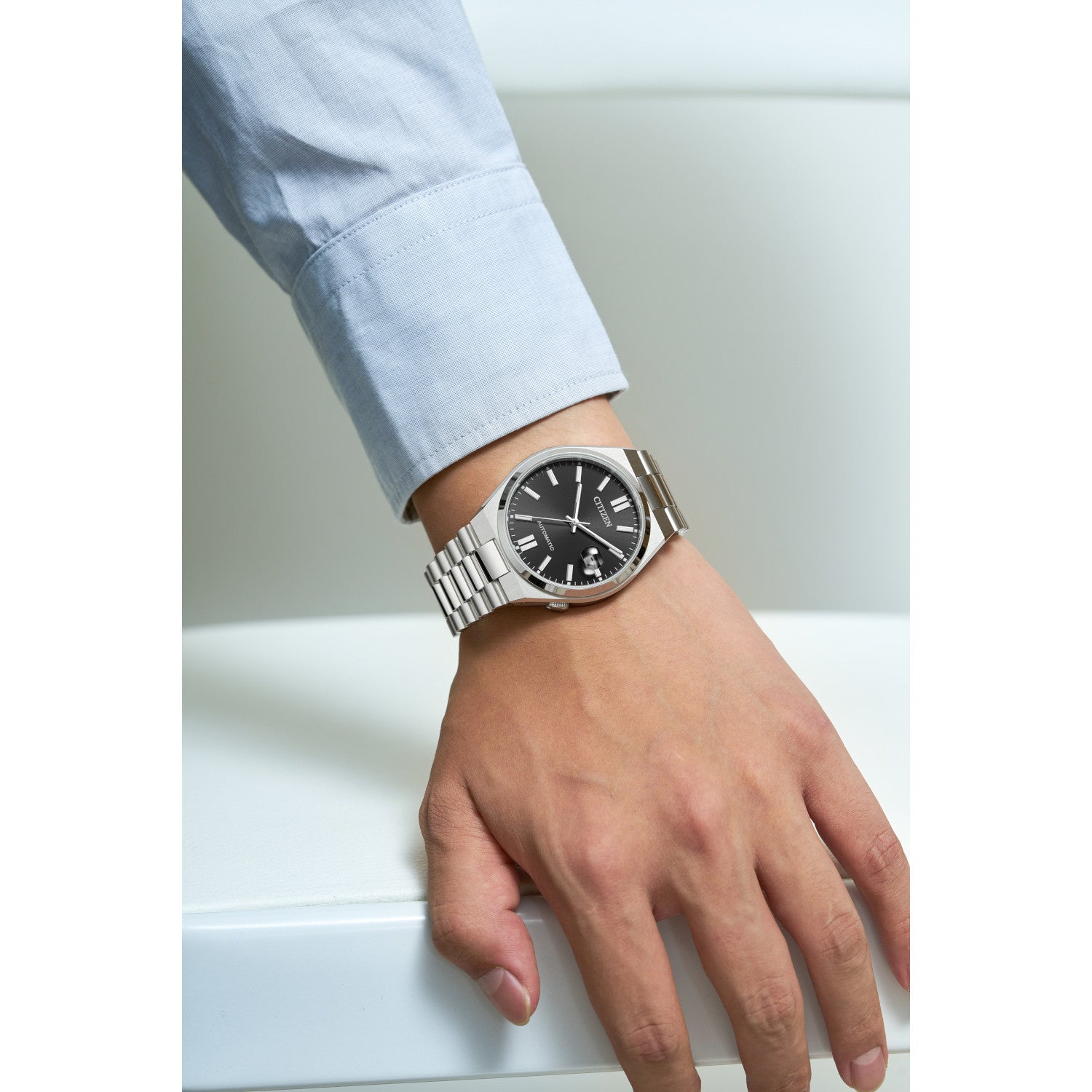 Model wearing the Citizen NJ0150-56E, demonstrating its versatile and elegant wrist presence.