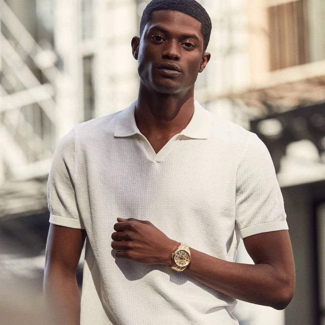 Model wearing the Bulova Sutton Automatic 97A162, demonstrating its elegant presence and the sophisticated combination of the gold-tone case and bracelet.