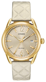 Citizen Drive Eco-Drive Ladies' Watch FE6082-08P featuring a 36mm gold-tone stainless steel case with a quilted ivory leather strap and light champagne dial—front view.