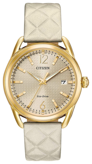 Citizen Drive Eco-Drive Ladies' Watch FE6082-08P featuring a 36mm gold-tone stainless steel case with a quilted ivory leather strap and light champagne dial—front view.
