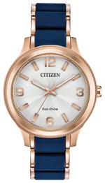 Citizen Drive Eco-Drive Ladies Watch FE7073-71A featuring a 36mm rose gold-tone stainless steel case with blue silicone center links and a silver-tone dial—front view