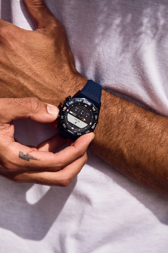 Model wearing the Citizen CZ Smart Hybrid Men's Watch JX1008-01E, demonstrating its elegant appearance on the wrist.