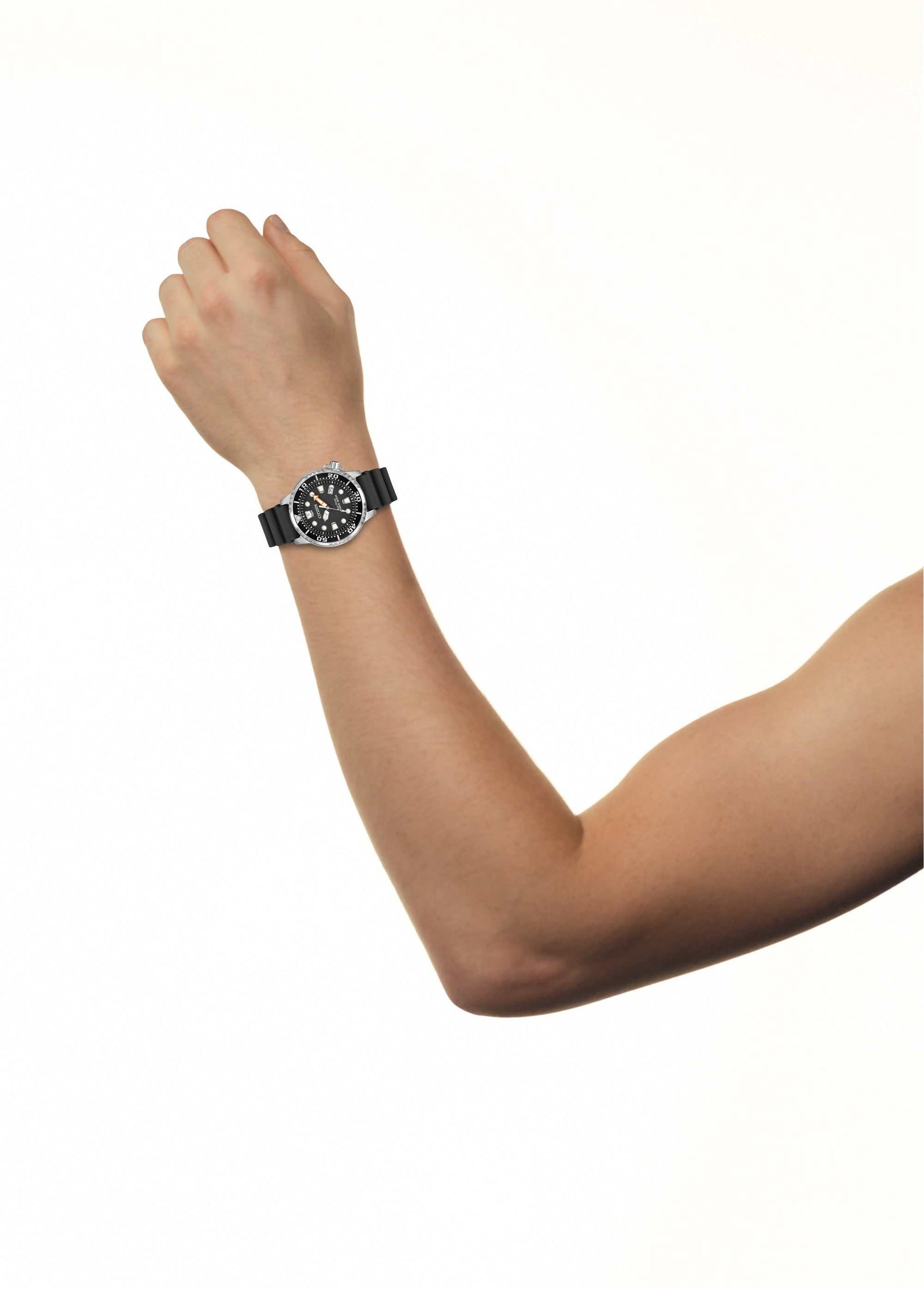 Model wearing the Citizen Promaster Diver Eco-Drive Watch BN0150-28E, demonstrating its robust appearance on the wrist.
