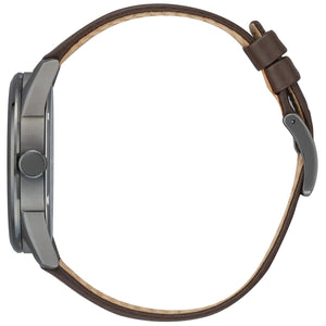 Side profile of the Citizen BM7417-01W, showcasing the gray ion-plated stainless steel case and textured leather strap.