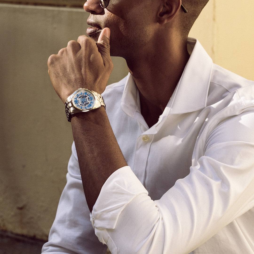 Model wearing the Bulova Sutton Automatic 96A187, demonstrating its elegant presence and the sophisticated combination of the skeleton dial and stainless steel bracelet.
