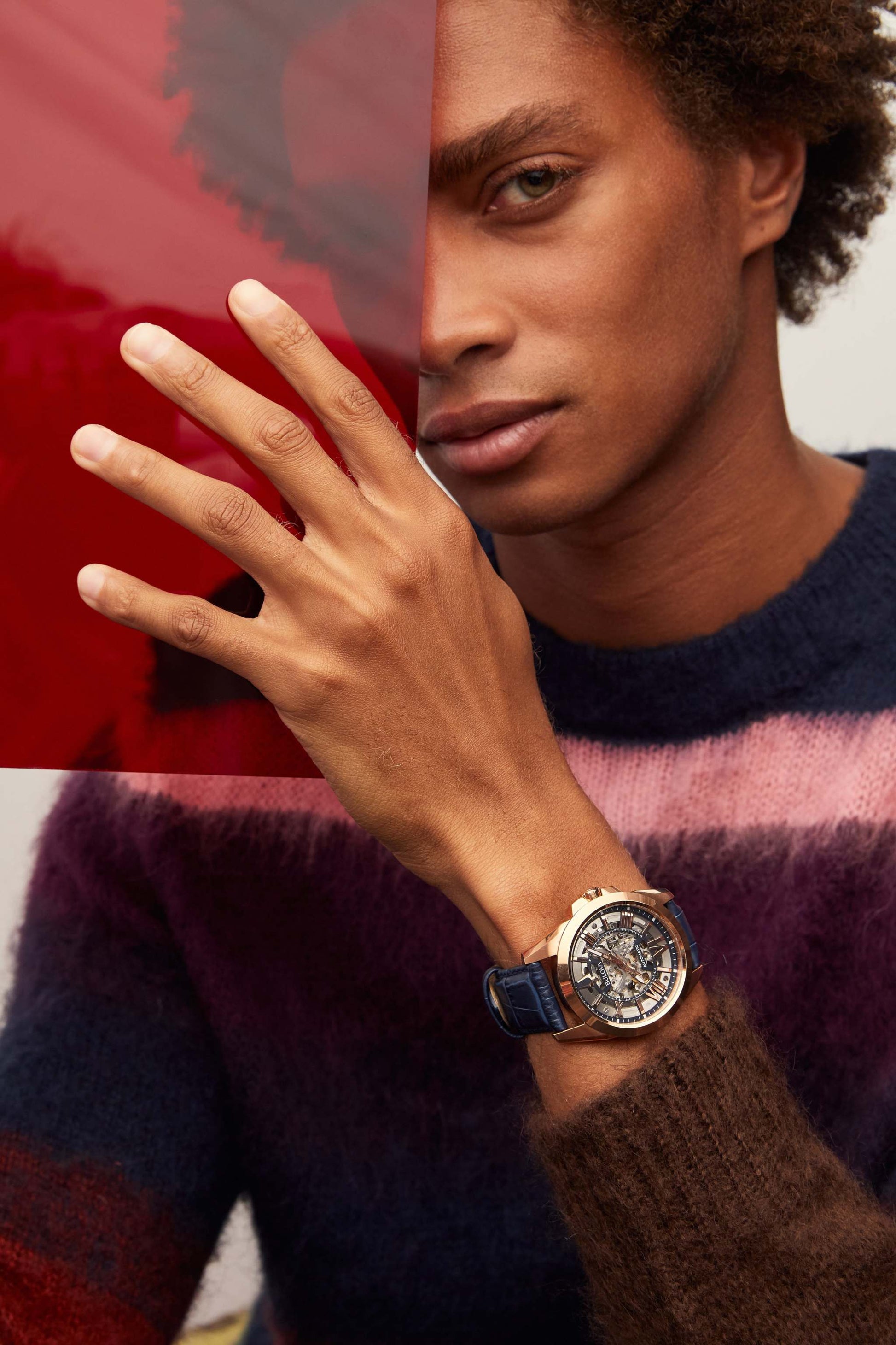 Model wearing the Bulova Sutton Automatic 97A161, demonstrating its elegant presence and the sophisticated combination of the rose gold-tone case and blue leather strap.
