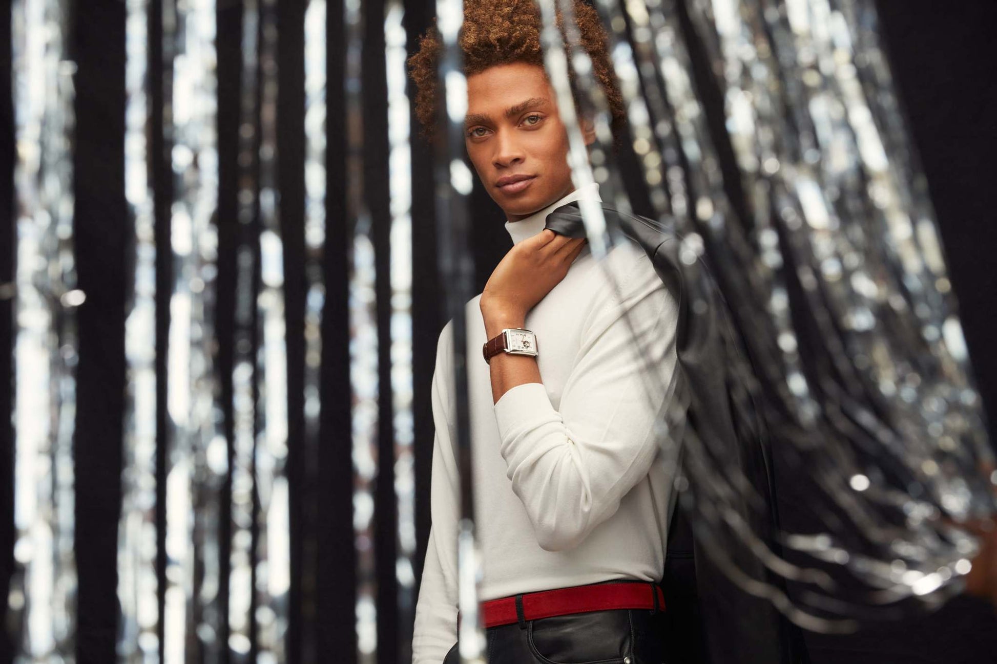 Model wearing the Bulova Sutton Automatic 96A268, demonstrating its elegant presence and the sophisticated combination of the silver-tone case with the brown leather strap.